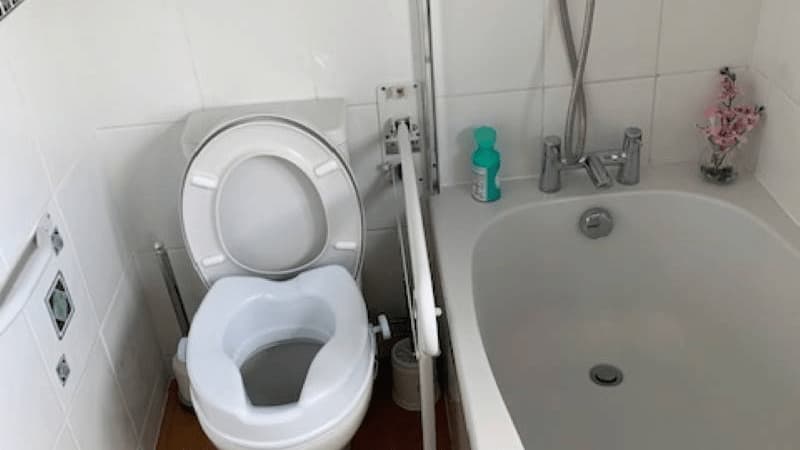 toilet with raised toilet seat