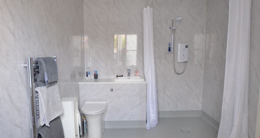 white tiled wet room